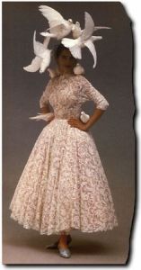 Of course, this beautiful wedding dress was inspired by the films of the legendary director Alfred Hitchcock, particularly The Birds. Of course, at least those birds in this picture are too dead to peck you to death.