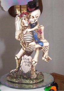 Now skeletons are one thing but French kissing skeletons over a grave? Now that's crazy. Even for a wedding on Halloween.