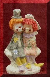 Now I'm not sure why anyone would want a circus themed wedding. Still, this clown couple is pretty much the epitome of tacky. You're better off with a topper of Cirque du Soleil.