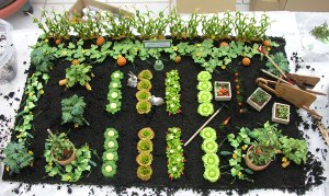 Okay, they may not be real veggies. Nor are they edible by any means. But still, it's a pretty cute scene nevertheless. Hope it has a container though.