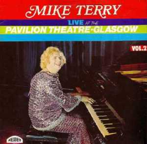 Seems like Liberace was such a success in the United States that the Brits wanted a flamboyantly gay concert pianist of their own. Seems like Mike Terry happened to be it in his sparkly attire.