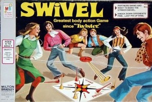 Like Groop Loop, Swivel also inspires some degree of family friendly bondage and randy horseplay. Yet, the difference with this one is that the players have to knock off opponents' cones and they tie ropes around their waists with pendulums in the middle.