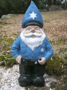 If it wasn't for the cone hat, I would've assumed him to be an actual police officer. Love the star badge on his hat though. 