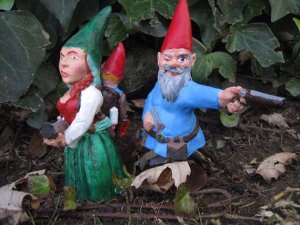 So while the father is armed with an ax and a dueling flintlock pistol, the mother appears to carry a loaded shotgun and the baby in her back harness. Still, I'm sure the gun he has can't be fired without being reloaded.