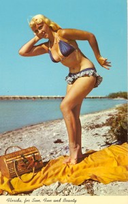 Well, she has some fun and sun all right. But I'm not sure she's a beauty per se, though some may beg to differ. Still, what the hell is she doing? Water in her ears? Practicing rain dance? Throwing a discus?