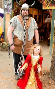 Now this has to be the most adorable hostage situation I have ever seen. This father must be a great sport to resort to this photo op.