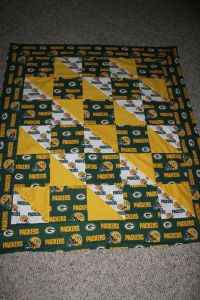 Now this quilt is guaranteed to protect you from the cold as well as passionate Green Bay Packers fans. Yes, they can be a rowdy bunch if you let them.
