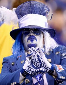 Yes, he's sitting in the stands trying to act so chill in his goofy hat and sunglasses. Still, you have to give it to him that he really loves his team.
