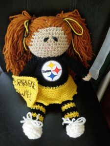 Now this is adorable with her little smile and pigtails. Also love her black and gold stockings.