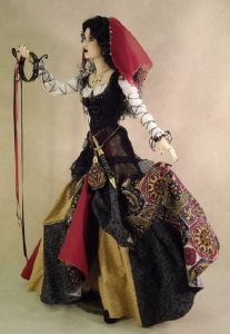 I've seen quite a few gypsy fashion dolls. But I think this one is especially lovely, especially the dress.
