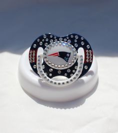 I have no qualms of the NFL selling pacifiers. But bling pacifiers? Seriously, why? A regular pacifier is cheap and does the job just as well. A bling pacifier is just so goddamned stupid.