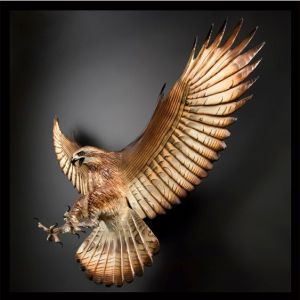 Hard to believe that this hawk sculpture looks so lifelike. Seems like there's nothing to keep it held up. Love the feathers, too.