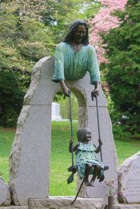 Now I know there are children buried in cemeteries and their markers are unsettling enough. However, this one really seems to scare the hell out of me. And it's not because Jesus is holding the swing and can't be seen by the waist down.