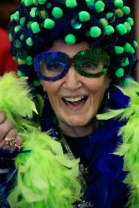 Yes, this granny has to wear her blue wig with green, her feather boas, and her sparkly frames. And now she's ready for showtime.