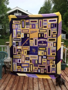 Yes, this is my second quilt on this post. But it's on display with a square pattern. Not to mention, this dog seems very happy about it.