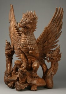 As you can see, this is an Asian carving. Probably from China or Japan. Not sure how old it is. But somehow it seems East Asian dragons tend to have scales and feathers.