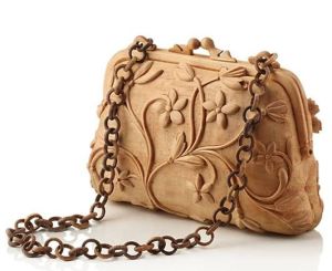 Now I wonder how they managed to carve out the chain. Would be very interesting to know. Love the floral design.