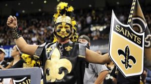 Yes, the hat is badass and so is the shield. Not sure about the makeup and the leather attire though. But it's all coordinated with the fleur de lys. 