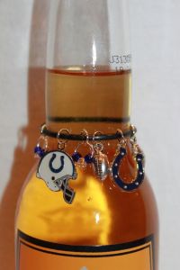 I have no idea why people would consider decorating their alcoholic beverage bottles. Such charms seem like useless decorations for me. Seriously, why?