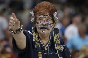 I don't know what's more disturbing. The ram horns or the fact she has a mustache as well as "Mom" on her chest. Also, the stars on her face don't help either.
