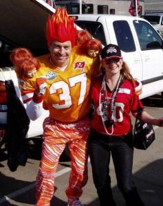 Of course, it should be obvious since his hair is practically on fire. Or so it seems. Still, the doll heads on his shoulders are creepy.