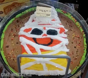 Oh, my God. For one, nobody likes candy corn, let alone with a smiley face. Second, it's even more stupid that it's made to look like a mummy.
