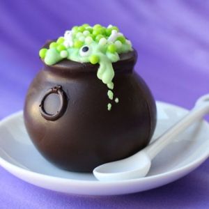 In this, the cauldron is made from chocolate. And the pudding is green with sprinkles on it. Still, I think this might be store bought from the looks of it.