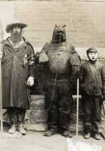 Now we wouldn't have a group costume like that today, just because we don't chain up bears anymore. Still, the bear is quite terrifying and so is the kid.
