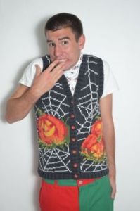 Seems like this guy is embarrassed to wear this. But he can't get out of it because his mother made it for him.