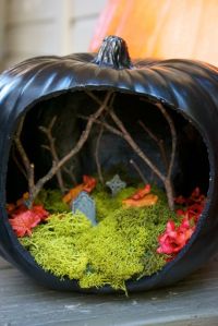 Now this one uses twigs for bare trees as well as moss for the graveyard ground. Not sure if the leaves are real.