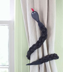 No, this isn't a real snake. I think it might be an old belt from the looks of it. Still, guaranteed to keep Indiana Jones away from your house.