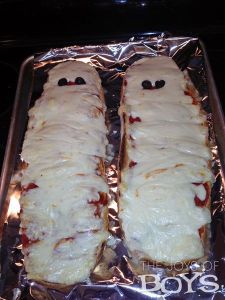 Now I did mummy pizza before in last year's post. But they were more personal types. This one is for long loaves of bread.