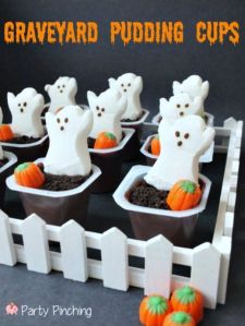 The ghosts are of the sugary marshmallow stuff associated with peeps. The pumpkins are candy corn. But I'm sure the chocolate pudding is edible and tasty, too.