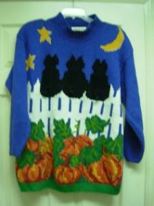 Does it mean bad luck or just 3 cats sitting on a fence. Either way, looks like the kind of Halloween sweater you'd see on a crazy cat person.