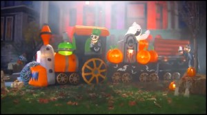 Funny how this train doesn't have any passenger cars. Still, love the ghost and pumpkins. Also, like the vampire rising from his coffin in the back.