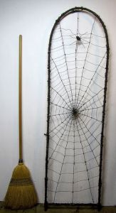 Of course, I can bet that this web was made by a tone of black yarn. Still quite cool though. However, I doubt that a spider would spin a web that big.