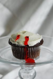 Now this looks quite doable. Just ice a cupcake, poke two holes, and add some red filling for blood.