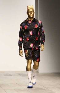 Because he's all covered in gold. Duh. However, he still needs to wear clothes though.