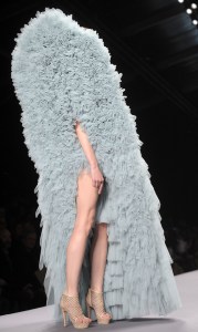 Wouldn't want to surf on that. Can't even see that person's face. Still, wonder how she could move around in that.