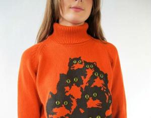 When looking at this sweater do you get the feeling that you're being watched? Or is it just me? Do those eyes seem creepy to you?