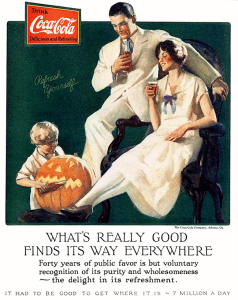 I don't know about you, but I'm wondering whether the little blond boy might be a spawn of Satan. I mean look at him. Never mind that he's trying to get a jack o'lantern to drink pop.