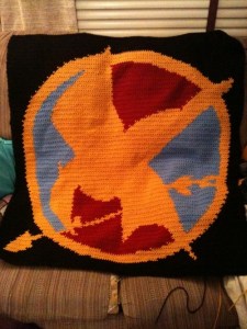 So I guess the blue and red are there because they were the colors of the later tow book covers. But the Mockingjay stands as clear as day.