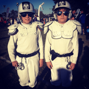 Now these guys certainly made their own costume as you can tell by the batting helmets and football shoulder pads. Doesn't hurt that they have toy police stuff, too.