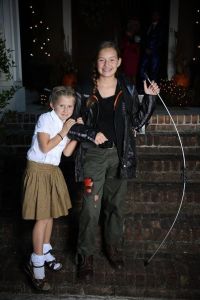 I'm sure Katniss's parents didn't buy most of her costume, especially the bow and ripped up pants. Still, that's an adorable picture.