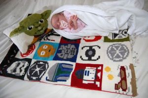 As you see here, this is a perfect gender neutral baby gift. And Yoda's even on the pillow.