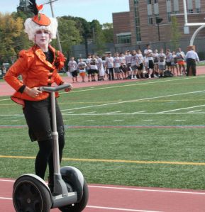 From what they said about this picture, the woman dressed as Effie is supposed to be a school principal. Let's hope it's for a high school, shall we?