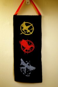 Consist of the Mockingjay logos you see on all 3 novels and in the same colors. Should go well with a lot of Hunger Games crafts.