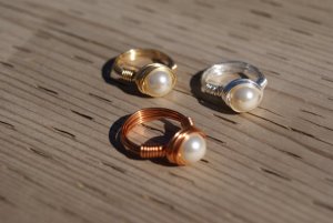 Available in gold, silver, and bronze. Still, if you don't know the significance of the pearl, then read the books.