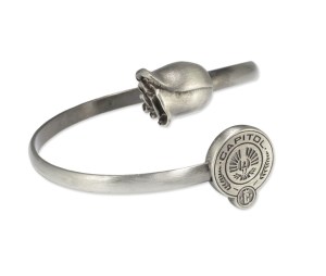 From Entertainment Weekly: "Forget Team Peeta and Team Gale, it’s all about Team Snow. Why not show your support for the misunderstood fascist dictator with this rose and Capitol seal bracelet? It is pretty, but isn’t the thought of wearing the emblem of an evil ruler (who doesn’t even have cool magical powers) a little disturbing?"