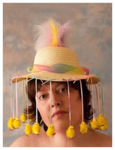Yes, the pom pom chicks are hanging from the hat. But at least they're there for the portrait.